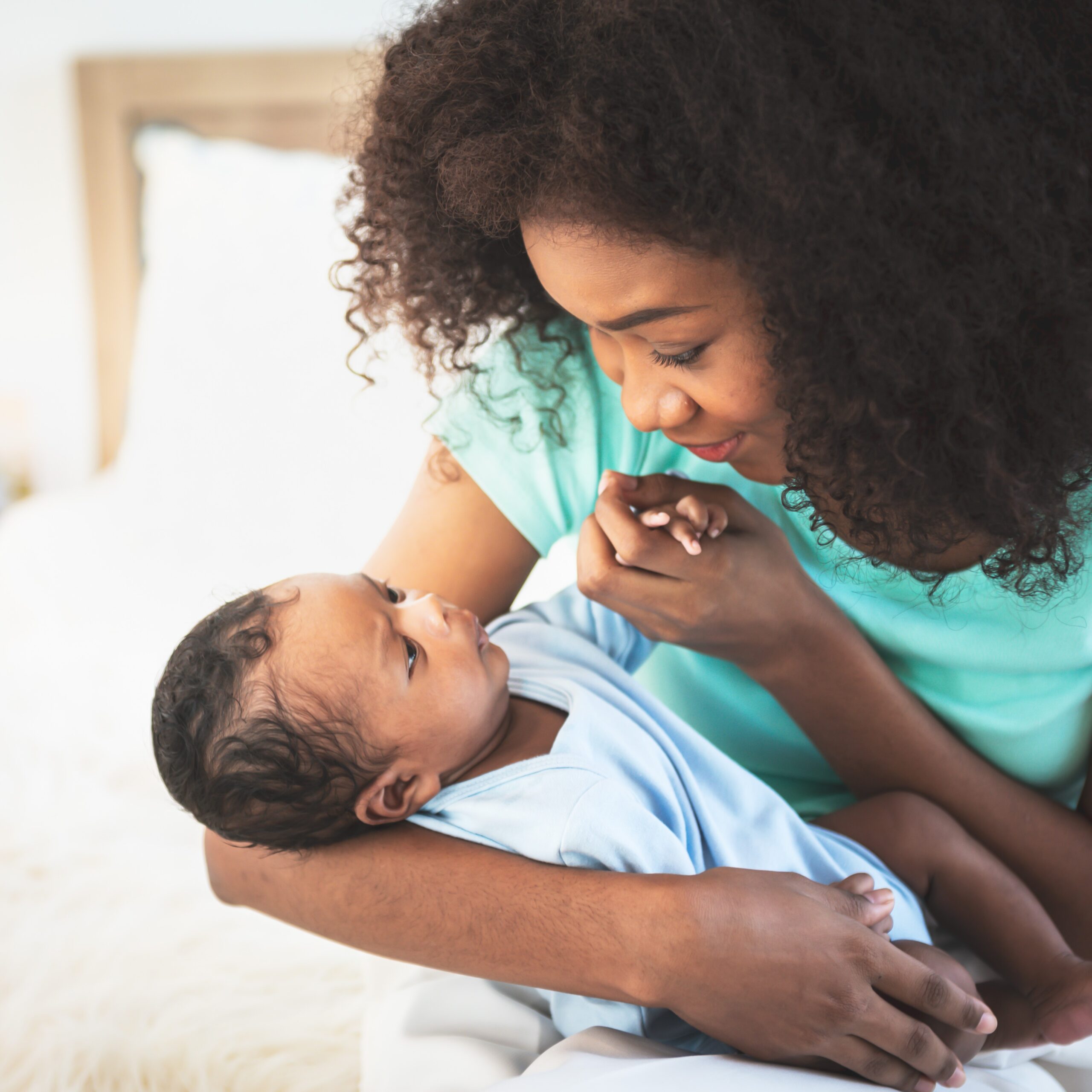 bigstock-An-African-American-Mother-Loo-477714445 Woman looking for free baby clothes and maternity items in Bedford, Indiana